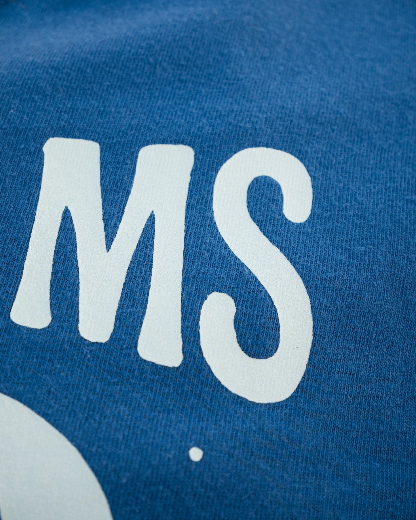 Close up on a navy blue shirt with print details